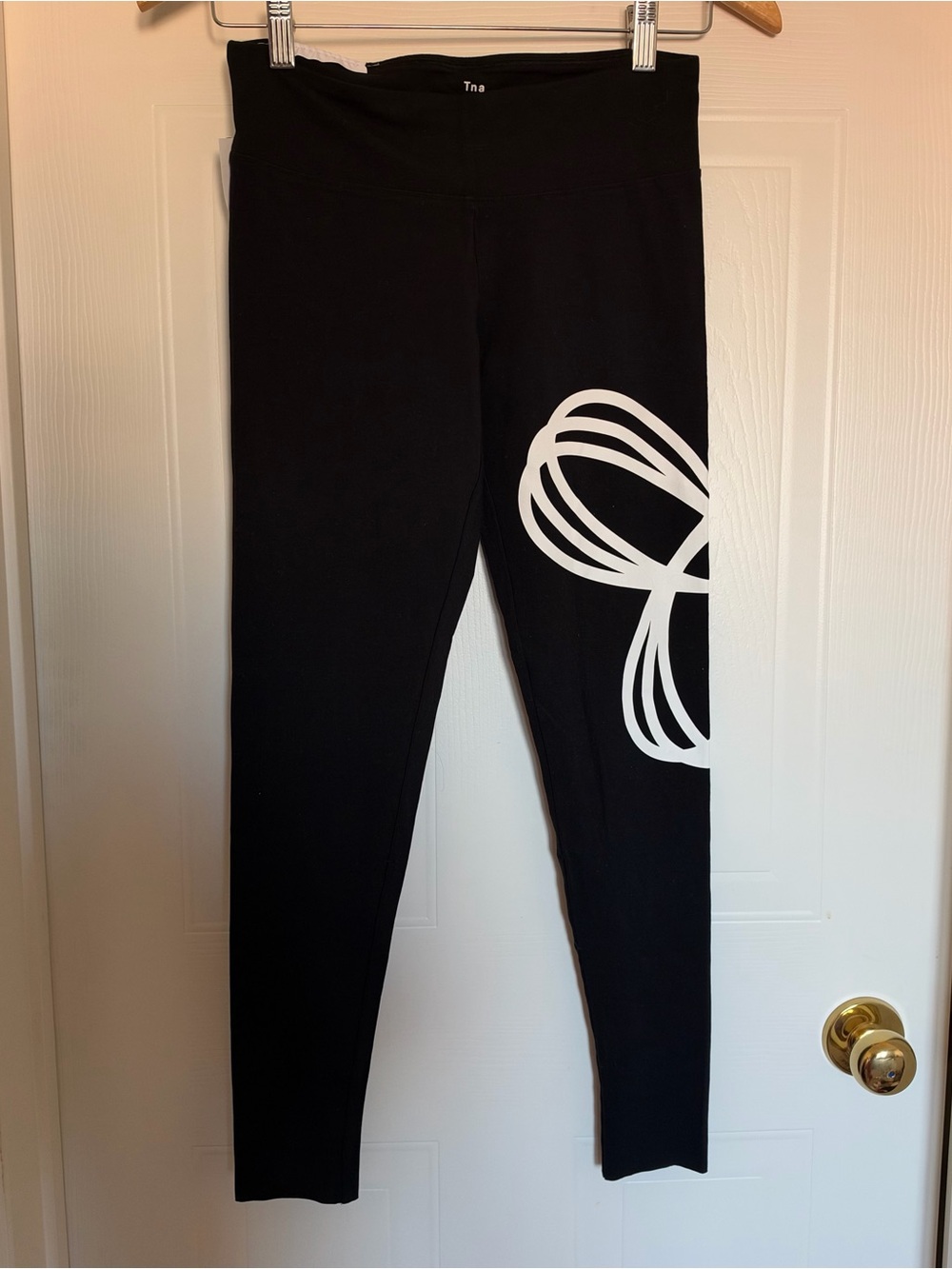 BNWT- TNA Black Leggings with White TNA logo